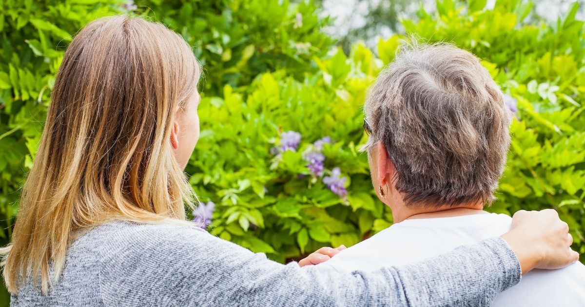 A daughter lovingly acts as her mother's informal caregiver.